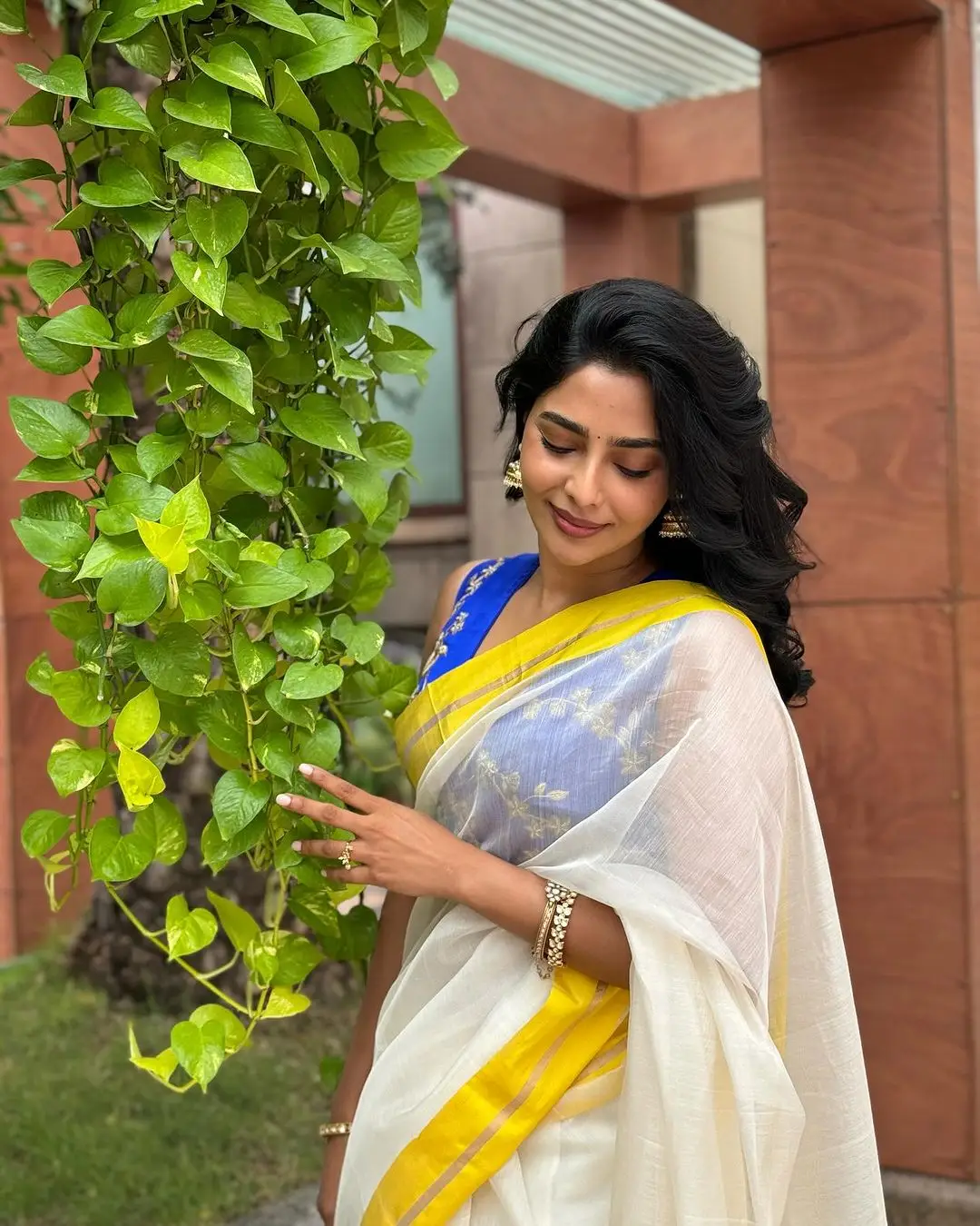 Aishwarya Lekshmi Wearing White Saree Blue Sleeveless Blouse